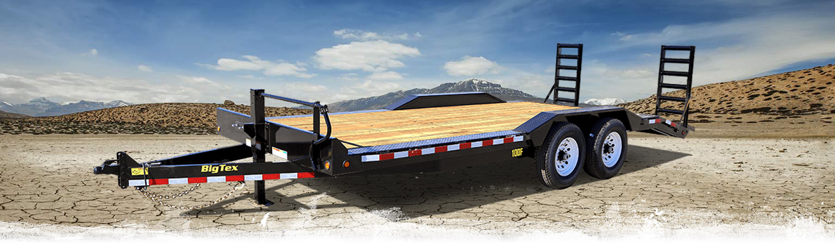 2017 Big Tex 10DF car hauler parked on a rugged terrain.